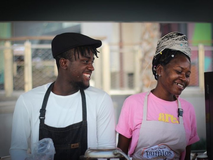 Two people at their street-food stall